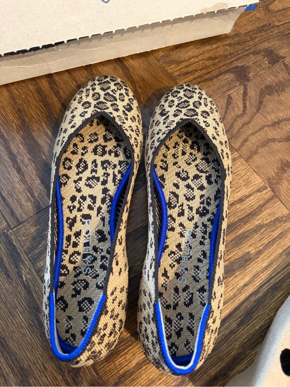 Rothy's Leopard-Print Slip-On Flats in Tan and Black with Blue Trim